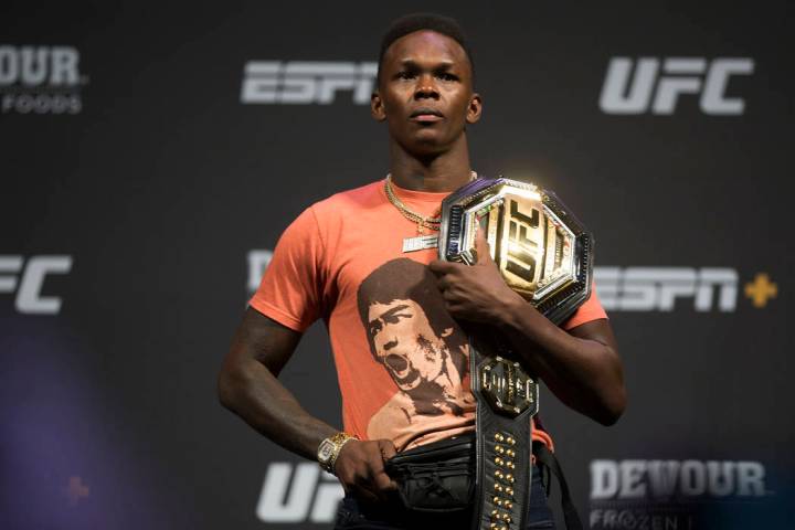 UFC interim middleweight champion Israel Adesanya holds his belt during a press conference on J ...