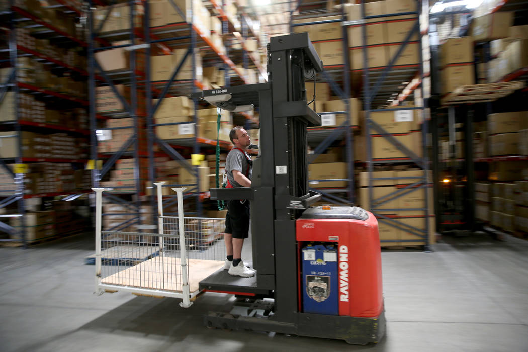 Cherry picker Christopher Giordani works in the new CarParts.com distribution facility in Las V ...