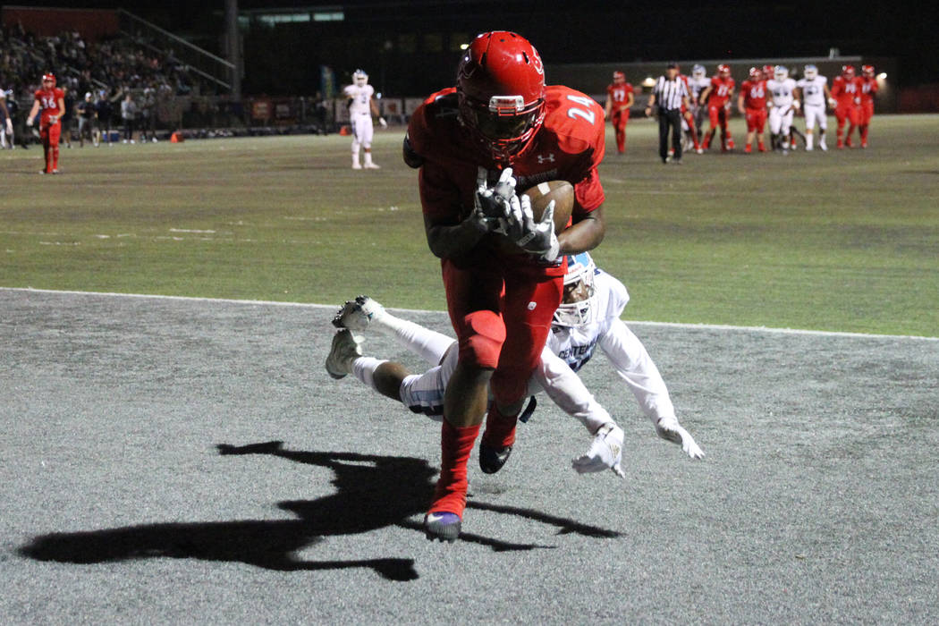 Arbor View's Daniel Mitchell (24) makes a catch for a touchdown against Centennial's Tyrone McC ...