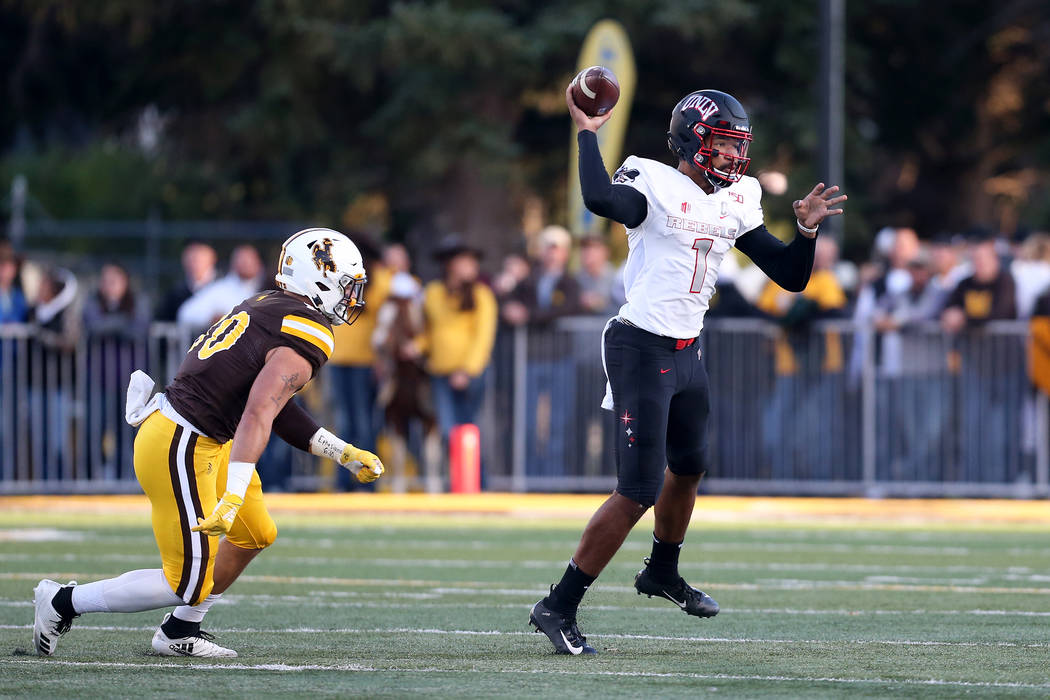 UNLV quarterback Armani Rogers throws a pass during the Mountain West game against the Universi ...