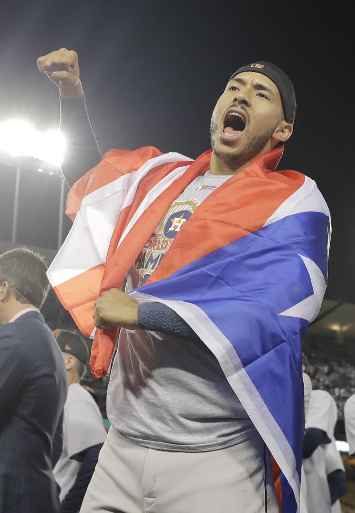 Houston Astros' Carlos Correa celebrates after Game 7 of baseball's World Series against the Lo ...