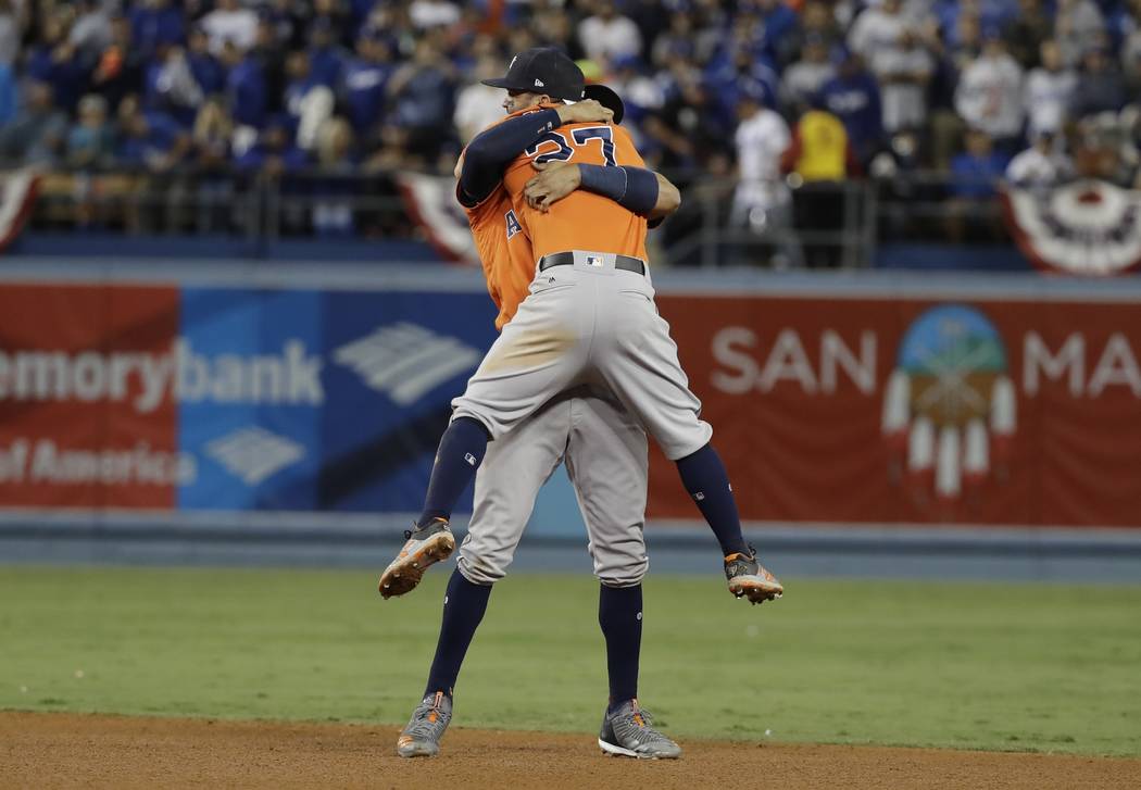 Houston Astros' Jose Altuve and Carlos Correa celebrate after Game 7 of baseball's World Series ...