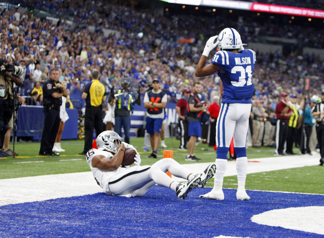 Oakland Raiders wide receiver Tyrell Williams (16) scores a touchdown as Indianapolis Colts cor ...