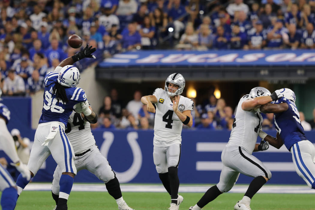 Oakland Raiders quarterback Derek Carr (4) throws the football over Indianapolis Colts defensiv ...