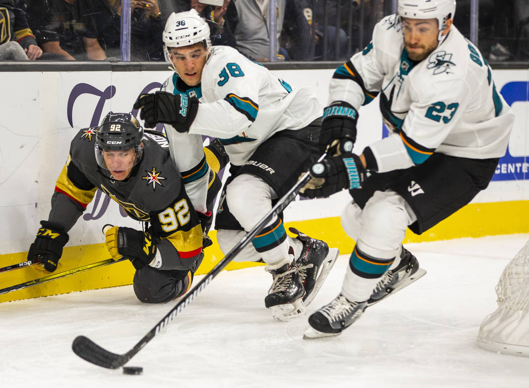 Vegas Golden Knights left wing Tomas Nosek (92) is taken down to the ice by San Jose Sharks def ...