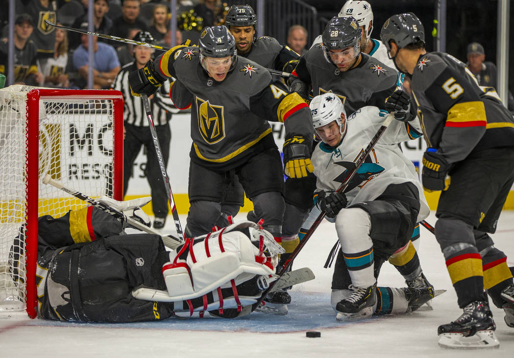 Vegas Golden Knights goaltender Marc-Andre Fleury (29) is down as his teammates help defend the ...