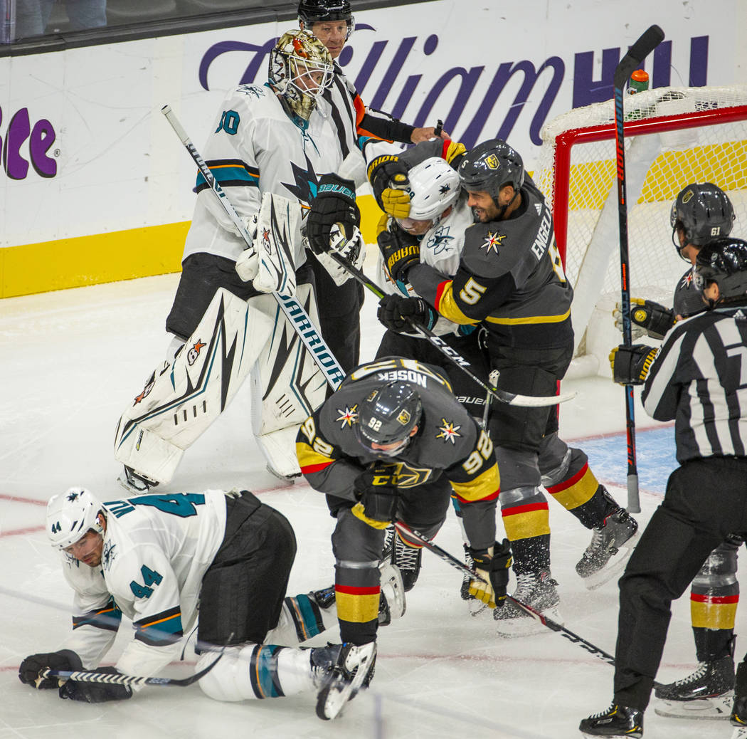 A fight breaks out on the ice after San Jose Sharks goaltender Aaron Dell (30) tripped up Vegas ...