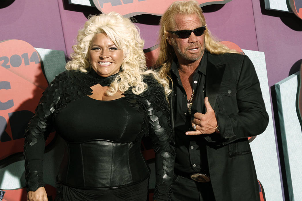 FILE - In this June 4, 2014 file photo, Beth Chapman, left, and Duane Chapman arrive at the CMT ...