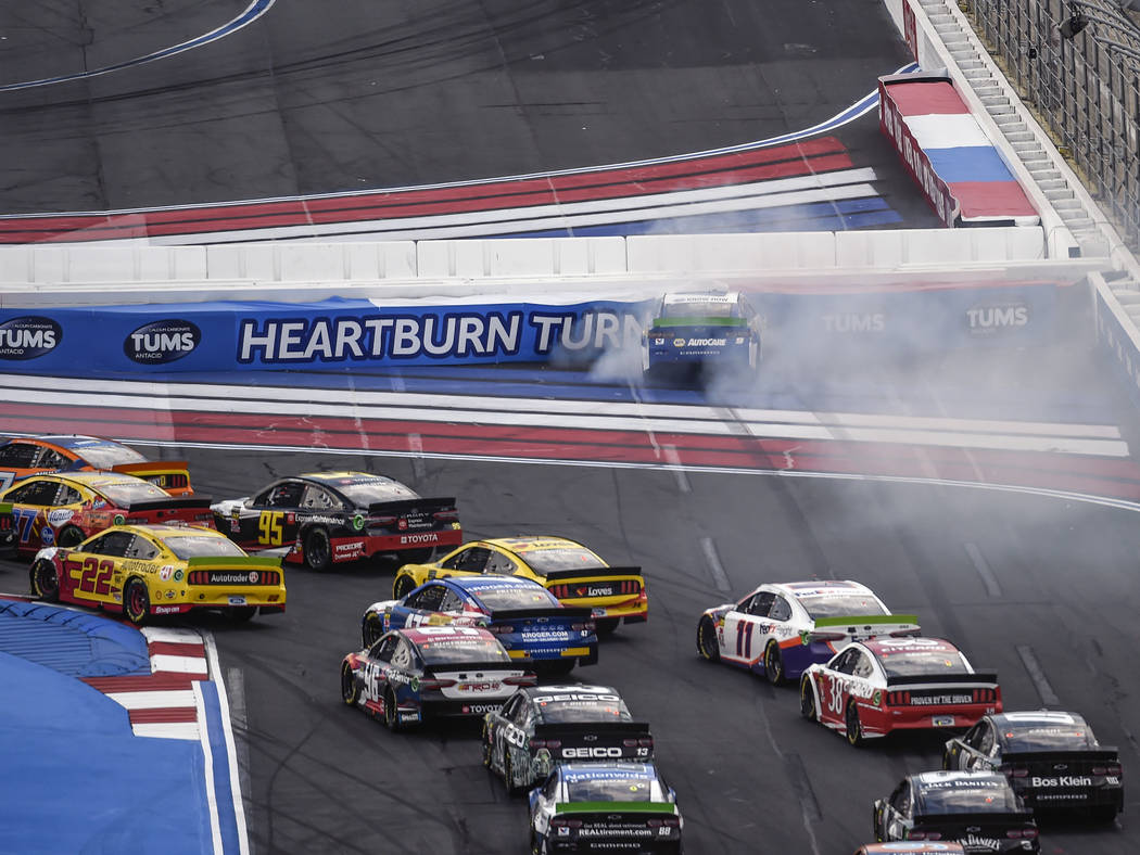 Chase Elliott (9) hits the wall in Turn 1 on a restart during a NASCAR Cup Series auto race at ...