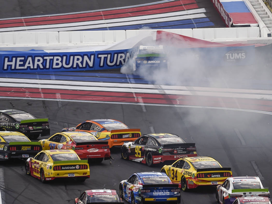 Chase Elliott (9) hits the wall in Turn 1 on a restart during a NASCAR Cup Series auto race at ...