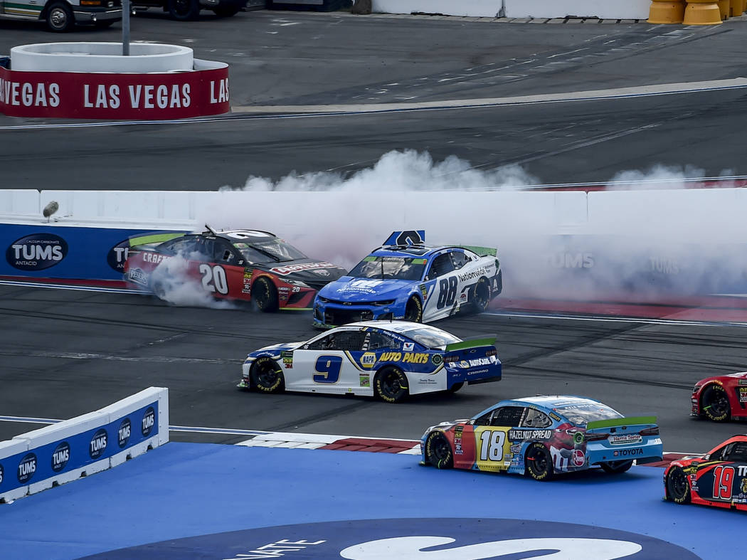 Erik Jones (20) and Alex Bowman (88) spin during the NASCAR Cup Series auto race at Charlotte M ...