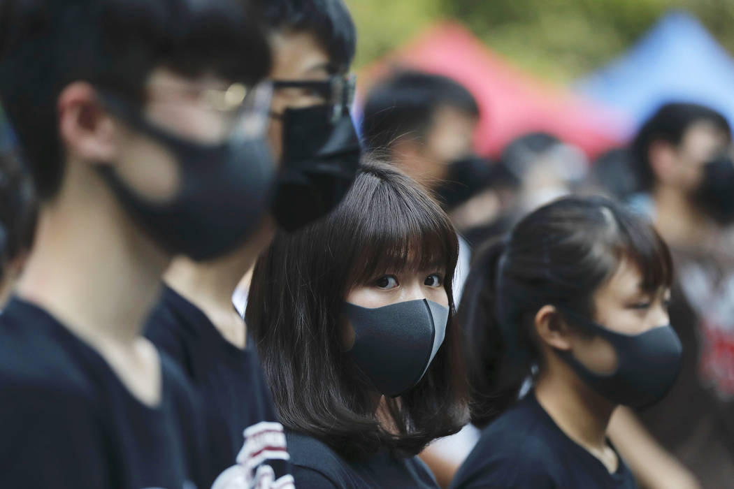 Students gather during a school children's strike event in support of protest movement in Hong ...