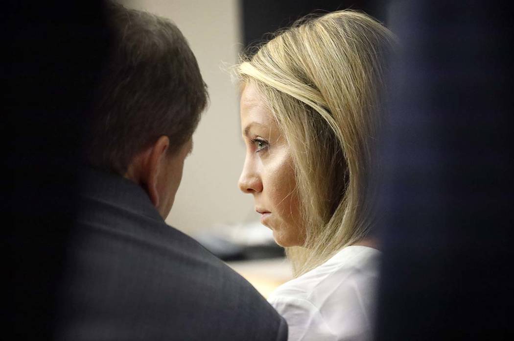 Former Dallas police officer Amber Guyger listens to her attorney Toby Shook during her trial a ...