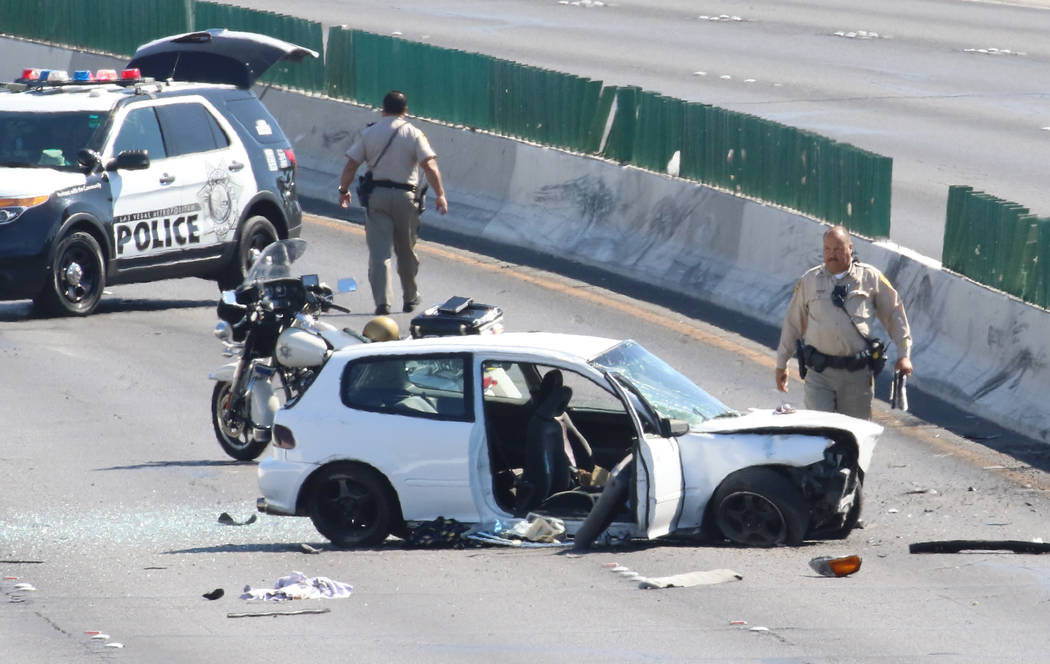 Las Vegas police investigate a crash where two people were critically injured at Desert Inn Roa ...