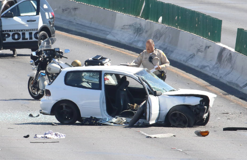 Las Vegas police investigate a crash where two people were critically injured at Desert Inn Roa ...