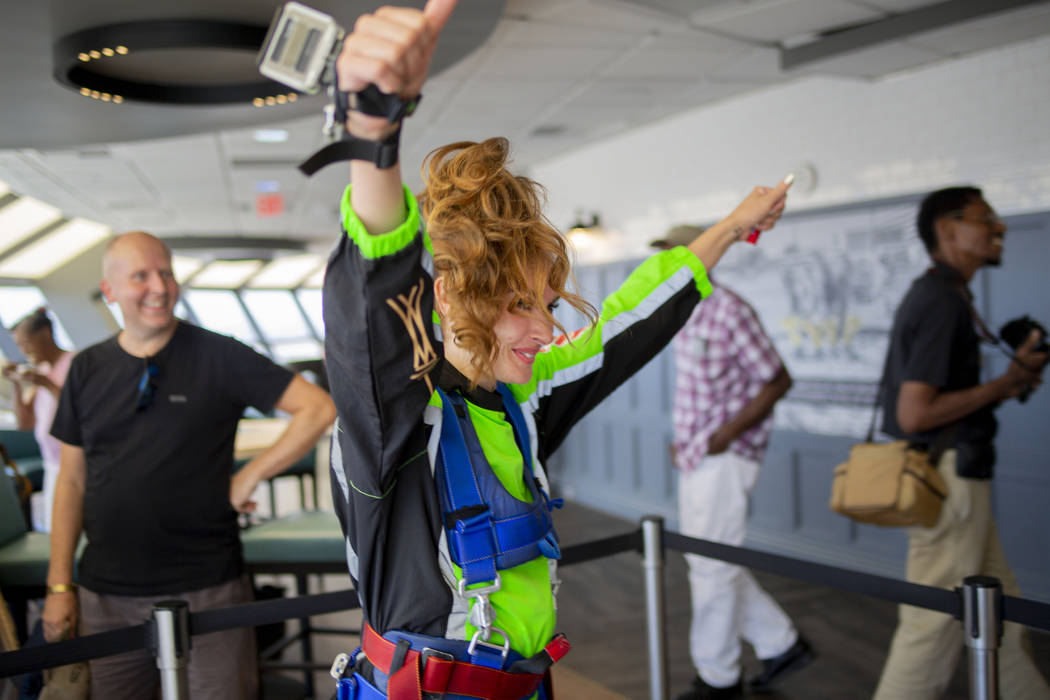 Annie Woolley, England, gets prepared to SkyJump at the Strat in Las Vegas, Thursday, Aug. 1, 2 ...