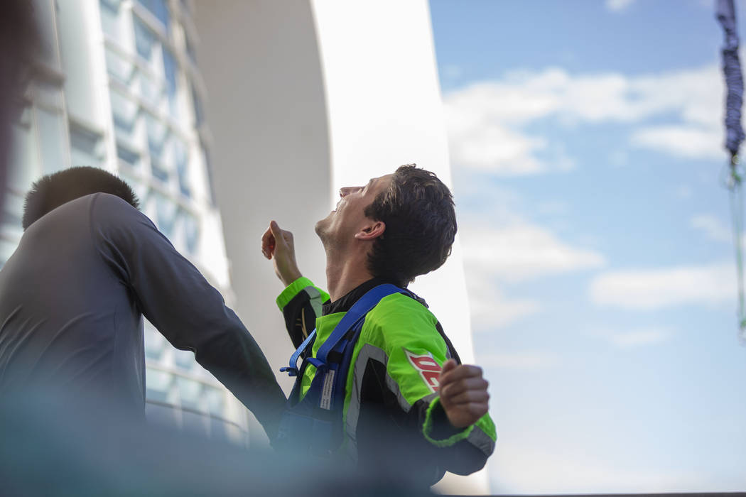 Cristobal Gonzalez, Mexico, looks up at where he just descended from after completing the SkyJu ...