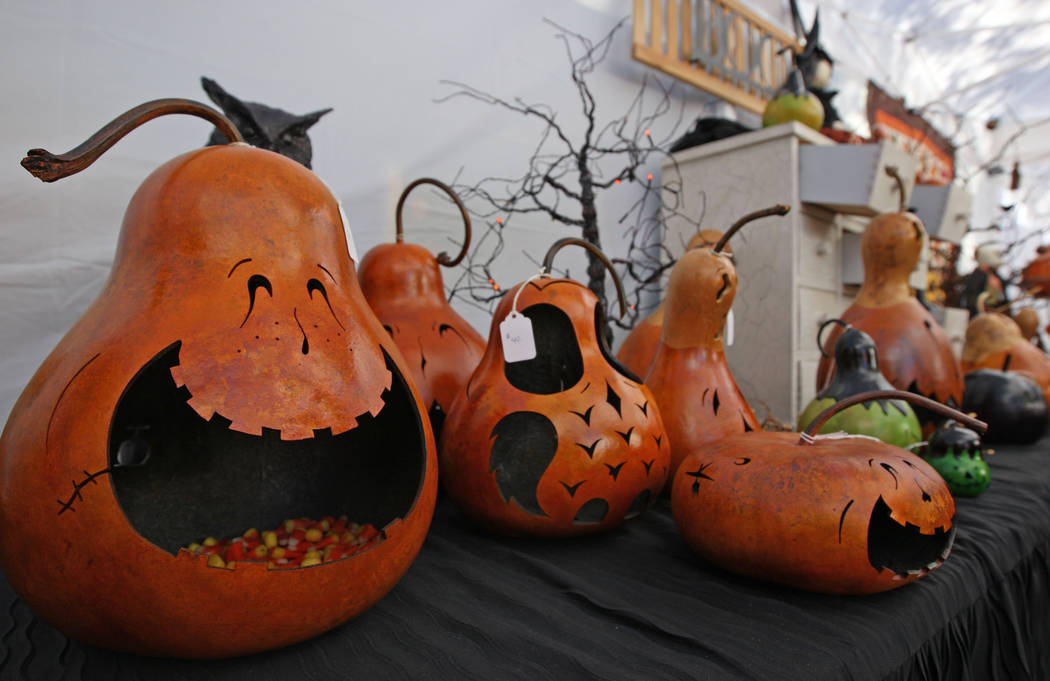 Hand-carved pumpkins from Out of Our Gourds on display during the Art in the Park festival in B ...