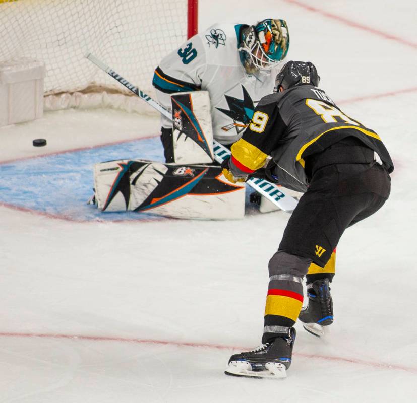 San Jose Sharks goaltender Aaron Dell (30) has another shot get past him from Golden Knights ri ...