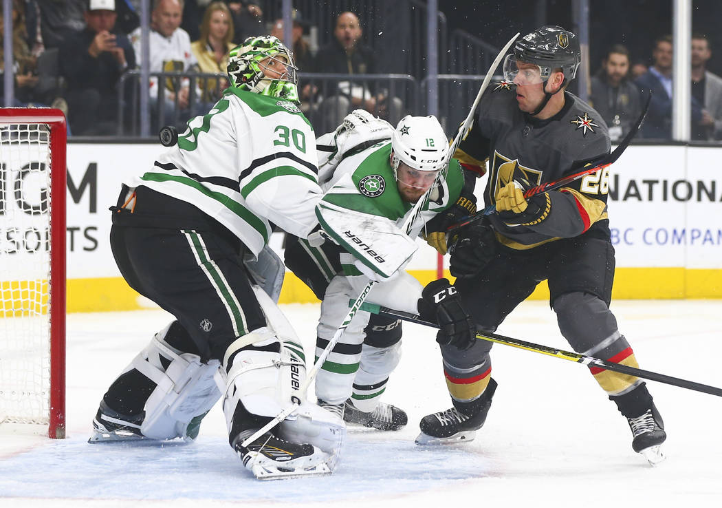 Dallas Stars goaltender Ben Bishop (30) tries to watch the puck falling behind him as Golden Kn ...