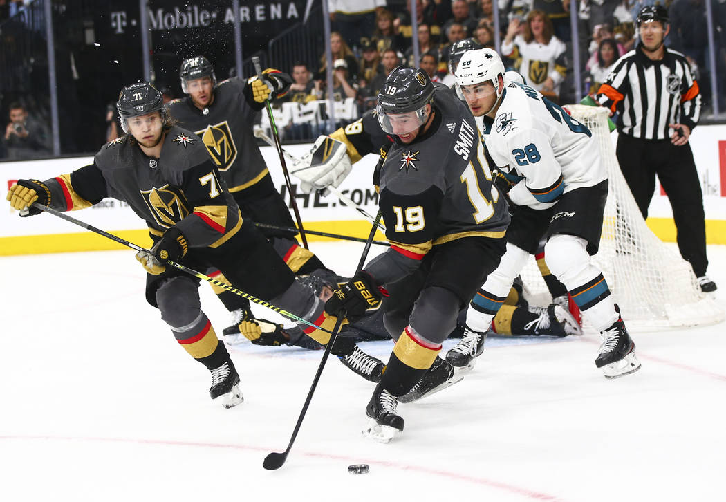 Golden Knights right wing Reilly Smith (19) moves the puck past San Jose Sharks right wing Timo ...