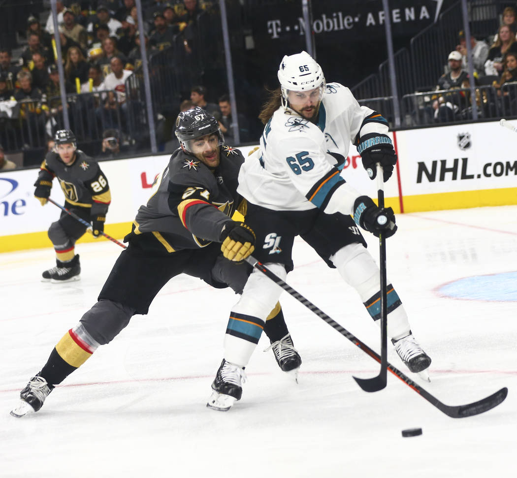 Golden Knights left wing Max Pacioretty (67) battles for the puck against San Jose Sharks defen ...
