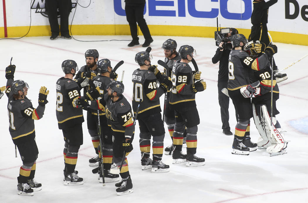 Golden Knights right wing Alex Tuch (89) celebrates a shutout victory with goaltender Malcolm S ...