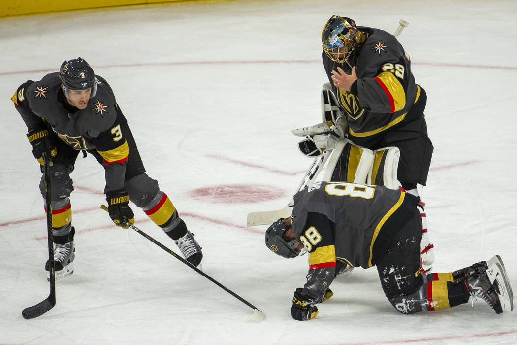 Vegas Golden Knights defenseman Nate Schmidt (88) is down injured on the ice versus the San Jos ...