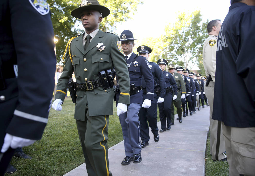 Members of the honor guard at the Clark County Government Center in Las Vegas on Tuesday, Oct. ...