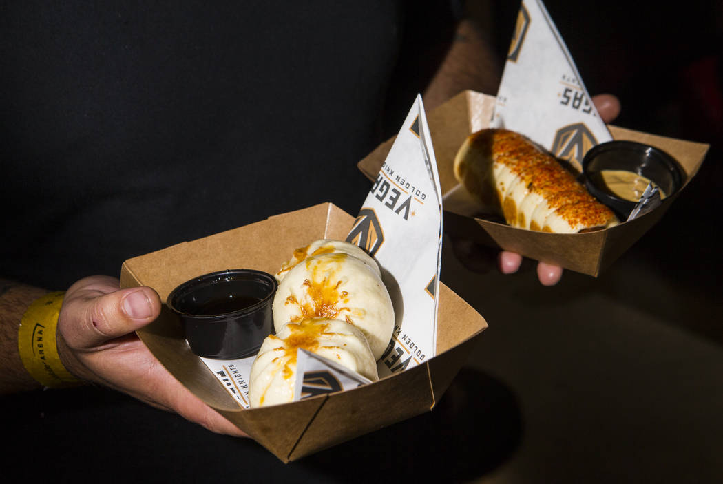 Graffiti Bao owner and chef Marc Marrone shows off offerings including Kung Pao chicken bao, le ...