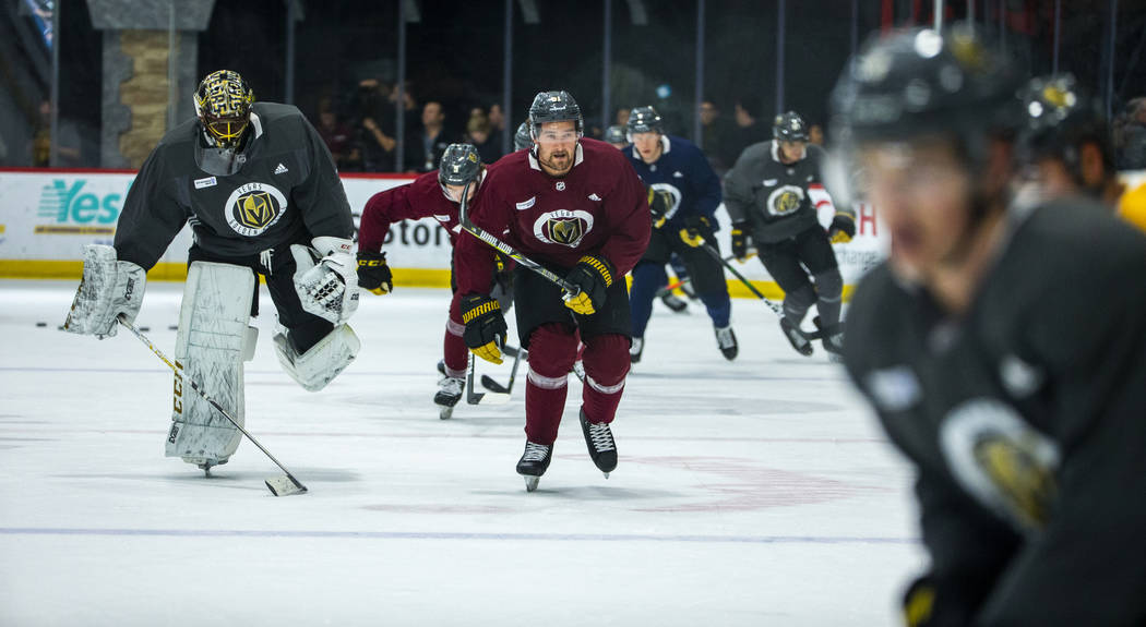 Vegas Golden Knights players skate around the ice as the team honors first responders, Mandalay ...