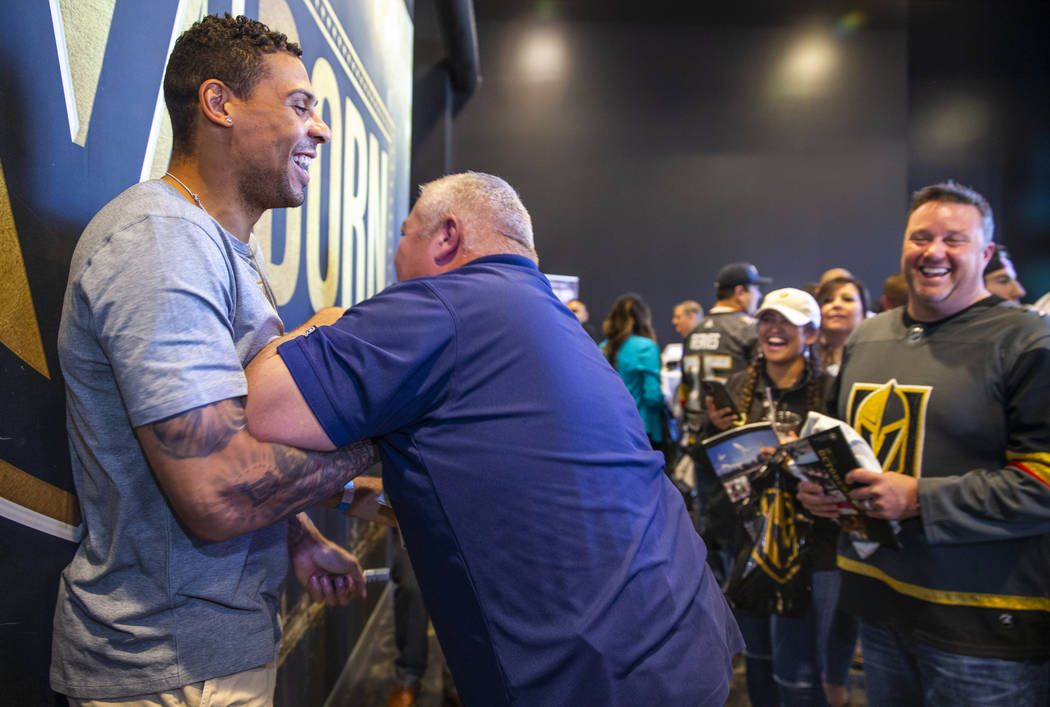 The Vegas Golden Knights Ryan Reaves, left, is playfully checked by Bob Byrd with Community Amb ...