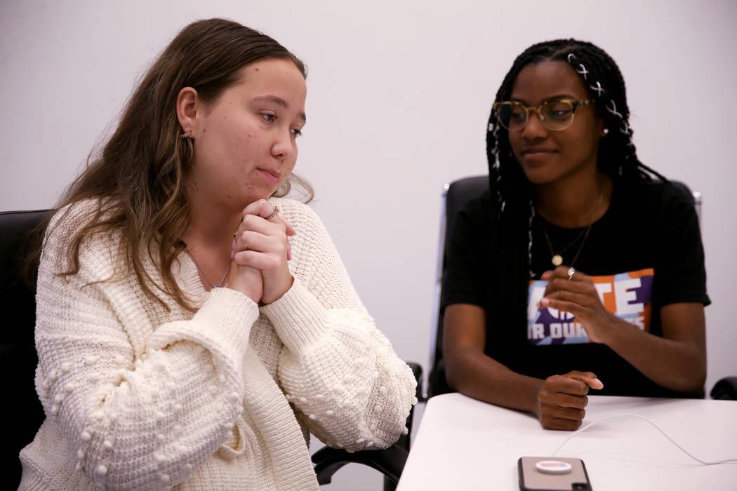Lauren Hogg, 16, of Parkland Fla., left, and Ariel Hobbs, 21, of Houston, talk to a reporter in ...