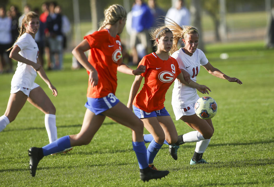 Bishop Gorman's Jaden Terrana (9) moves the ball in front of Coronado's Heather Mitchell during ...