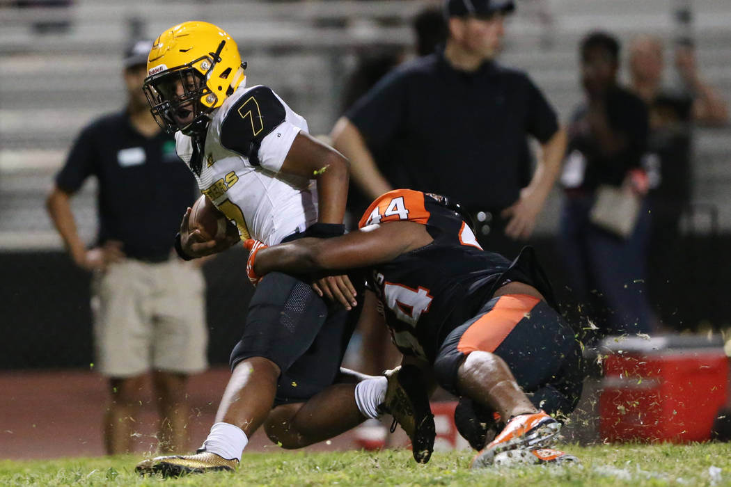 Clark's My'quel Johnson(7) is tackled by Chaparral's Robert Whitstone (44) in the second quarte ...