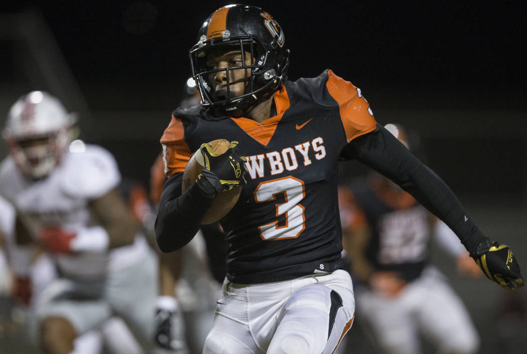 Chaparral senior running back Meshach Hawkins (3) sprints up field past Liberty defenders in th ...