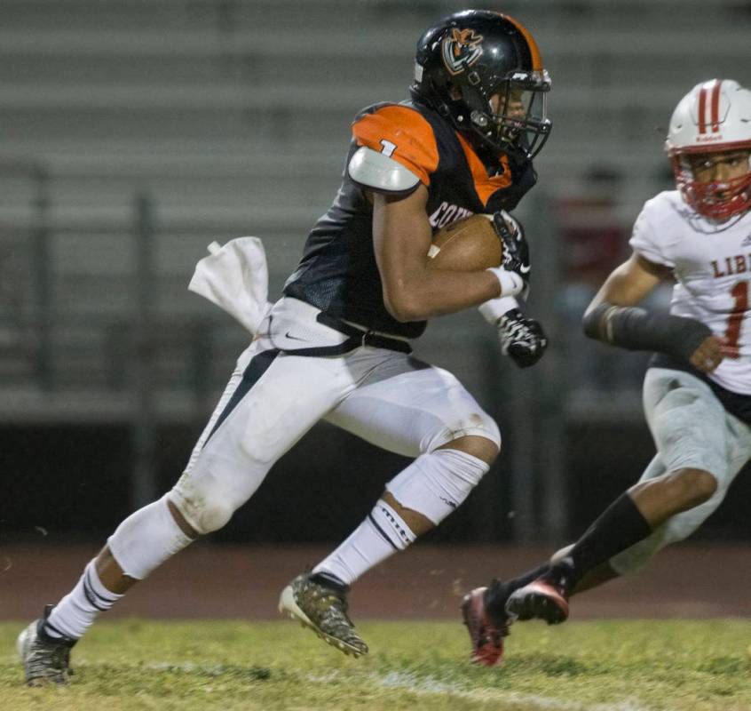 Chaparral senior wide receiver Lopu Tauli'ili (1) makes a reception past Liberty senior corner ...