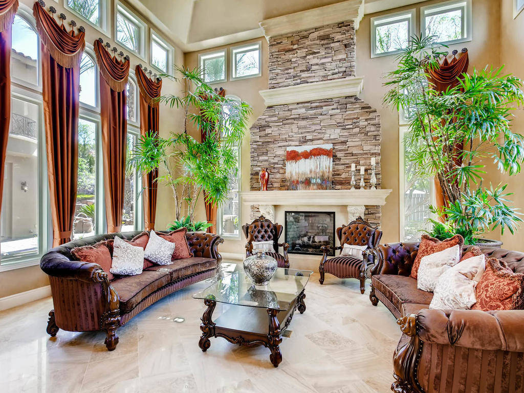 A fireplace is the center of the expansive living room. (Virtuance)
