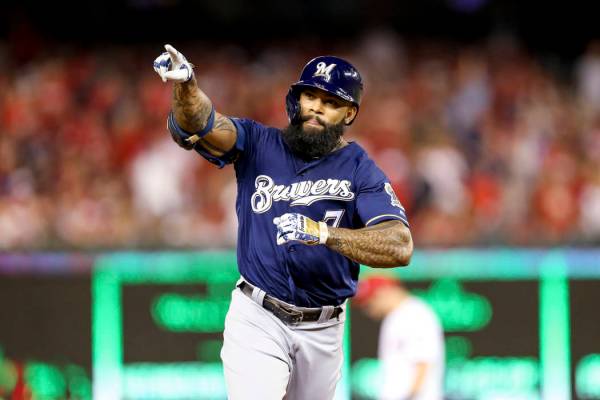 Milwaukee Brewers' Eric Thames gestures after hitting a solo home run during the second inning ...