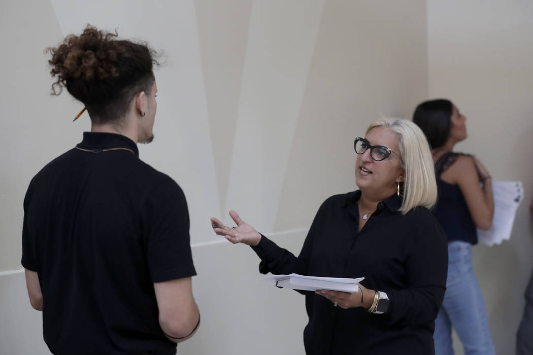 In this Tuesday, Oct. 1, 2019, photo, Gory Rodriguez, of Starbucks, right, interviews a job app ...