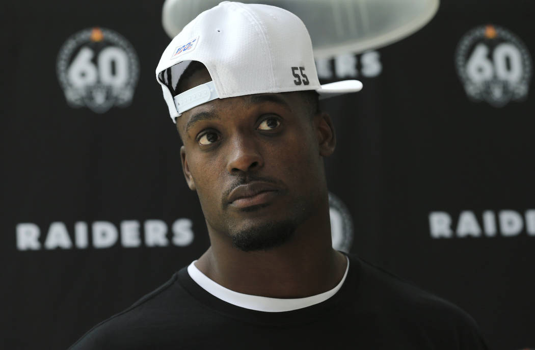 Oakland Raiders' linebacker Tahir Whitehead wears a cap with the number 55 in support of his ba ...