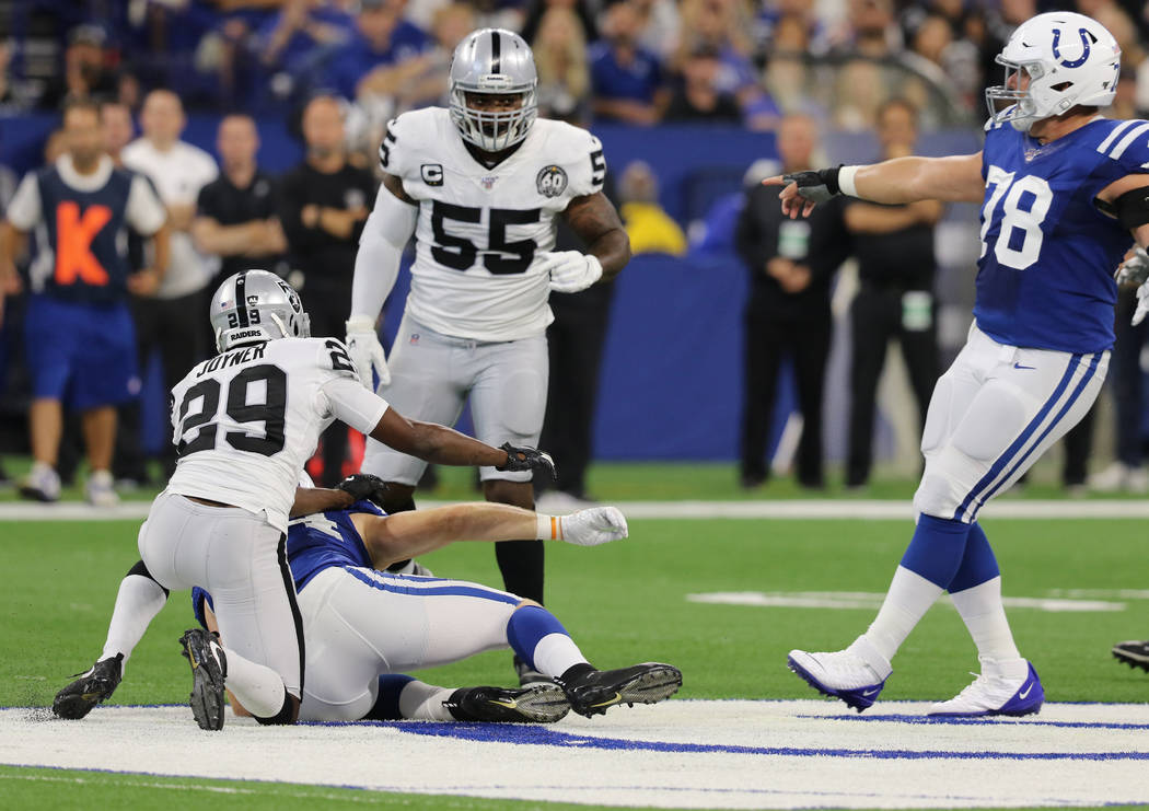 Indianapolis Colts center Ryan Kelly (78) points at Oakland Raiders outside linebacker Vontaze ...