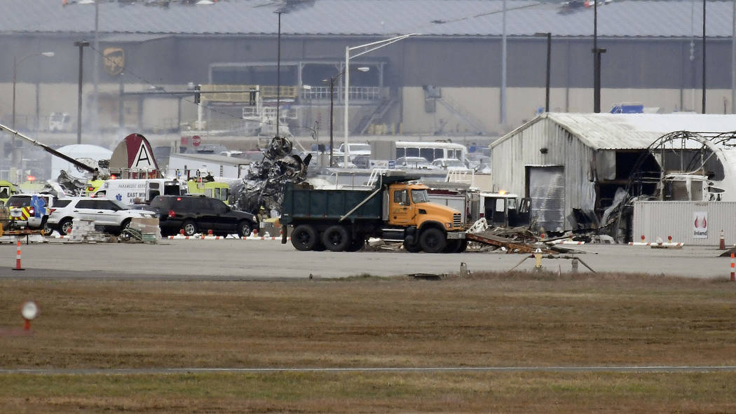 A fire-and-rescue operation is underway where World War II-era bomber plane crashed at Bradley ...