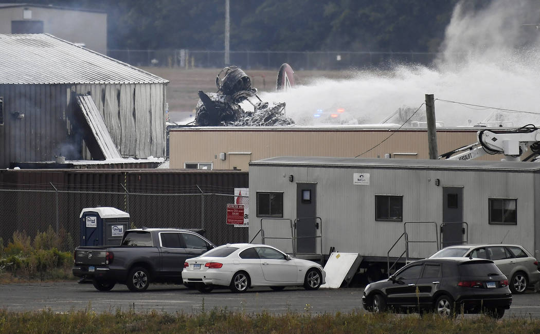 A fire-and-rescue operation is underway where World War II-era bomber plane crashed at Bradley ...