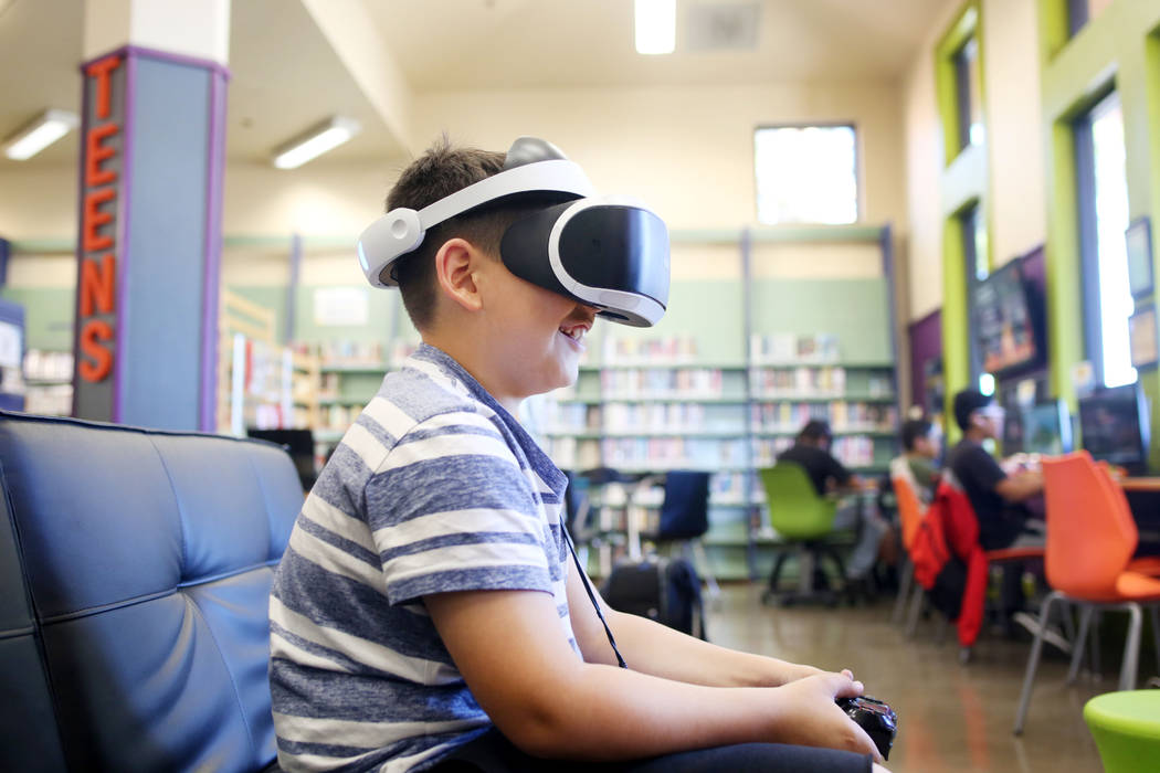 Dominic Giorgi, 10, Henderson, plays a PlayStation 4 VR game in the teen center at Green Valley ...