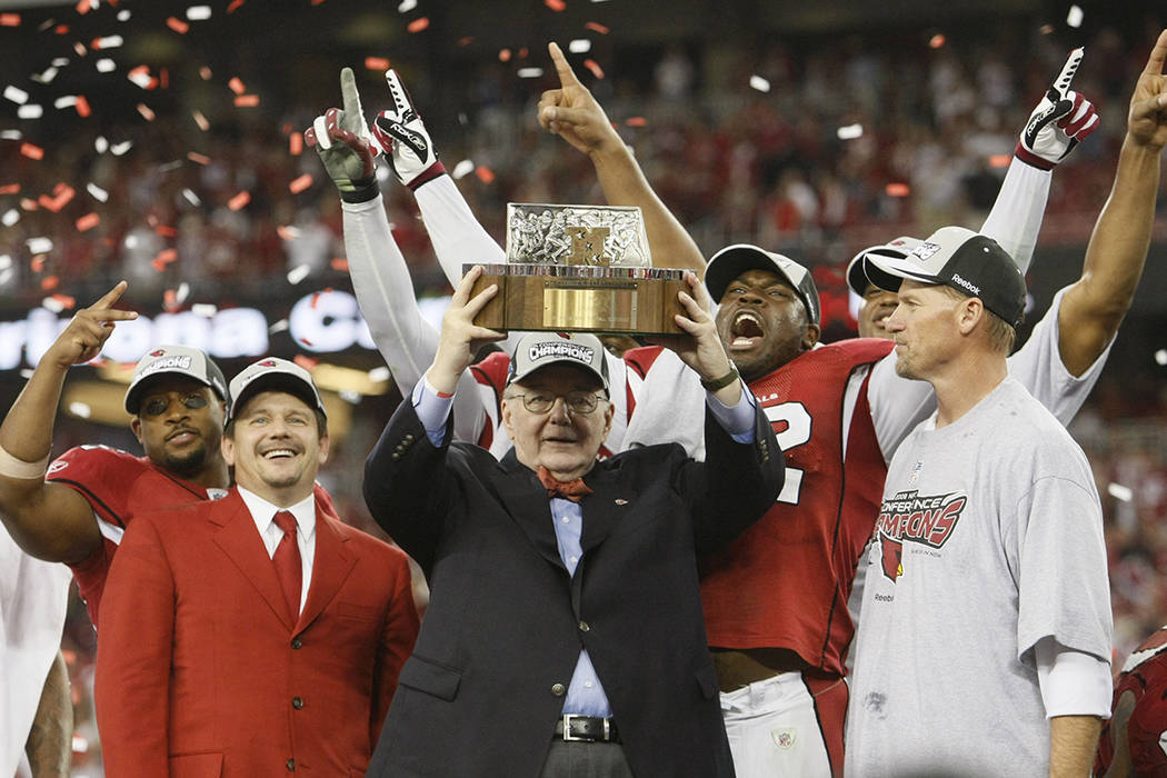 FILE - In this Jan. 8, 2009, file photo, Arizona Cardinals owner Bill Bidwell holds up the NFC ...