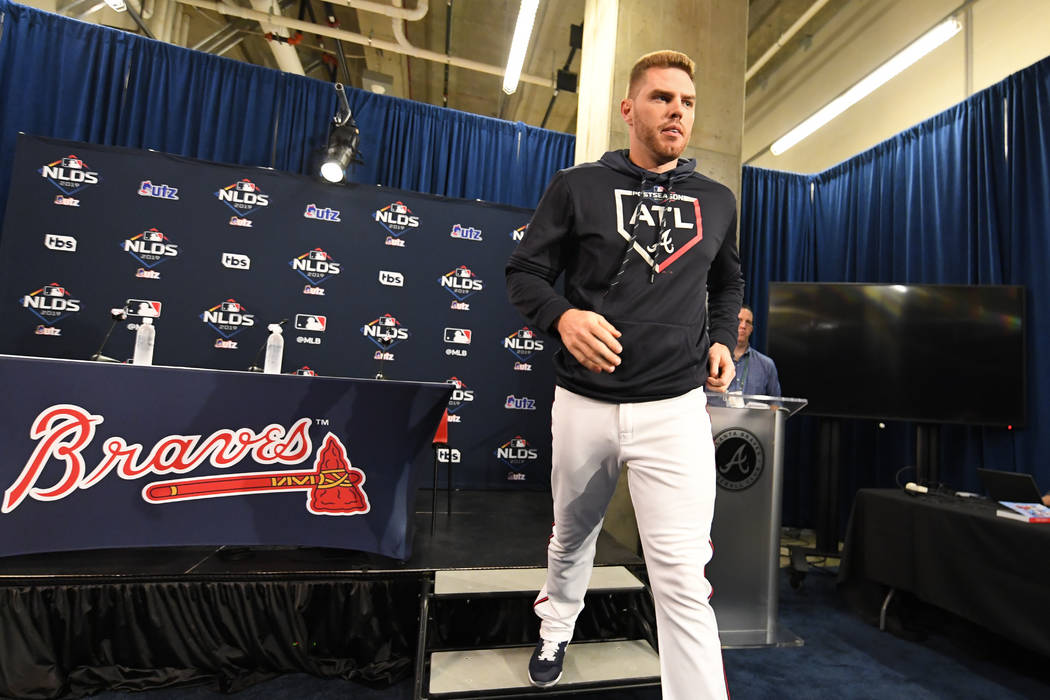 Atlanta Braves first baseman Freddie Freeman leaves a news conference before a baseball team wo ...