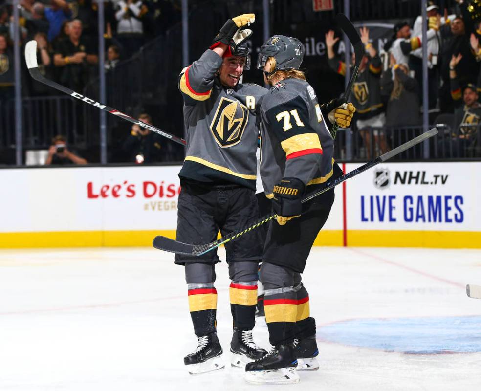 Golden Knights' Reilly Smith, left, and William Karlsson (71) celebrate a shorthanded goal agai ...