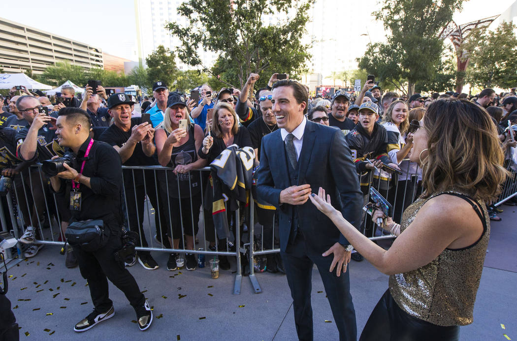 Golden Knights' Marc-Andre Fleury reacts while walking the gold carpet after arriving for the N ...