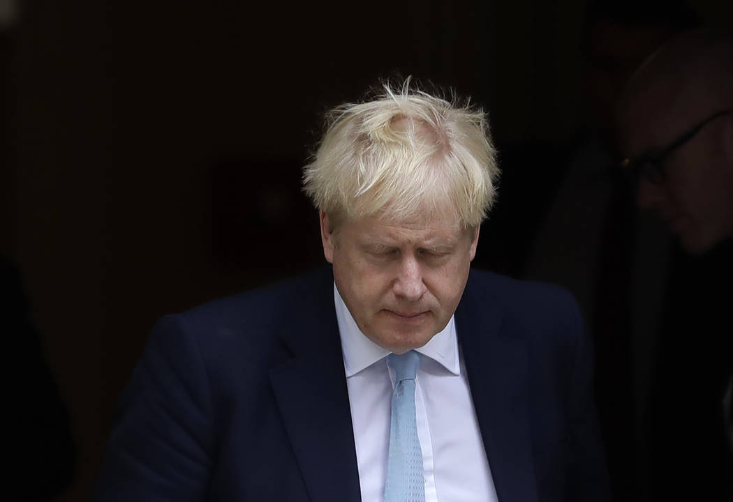 Britain's Prime Minister Boris Johnson leaves Downing Street to attend Parliament in London, Th ...